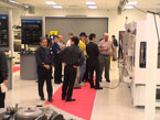 Fuji Machine Demo Center with group gathered around machine